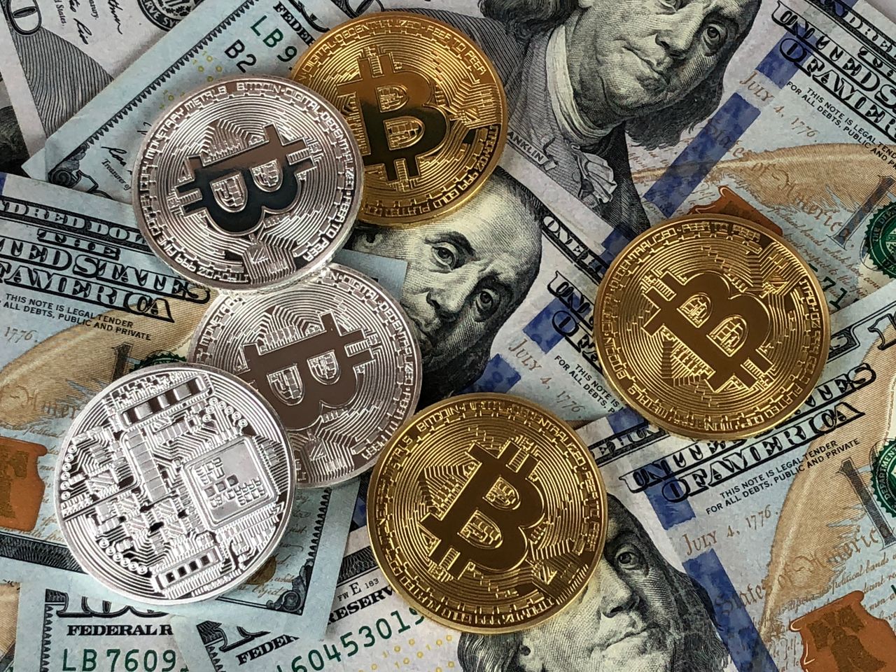 Mastering the First Impression: Your intriguing post title goes here Close-up of bitcoins and US dollar bills symbolizing modern finance and cryptocurrency.