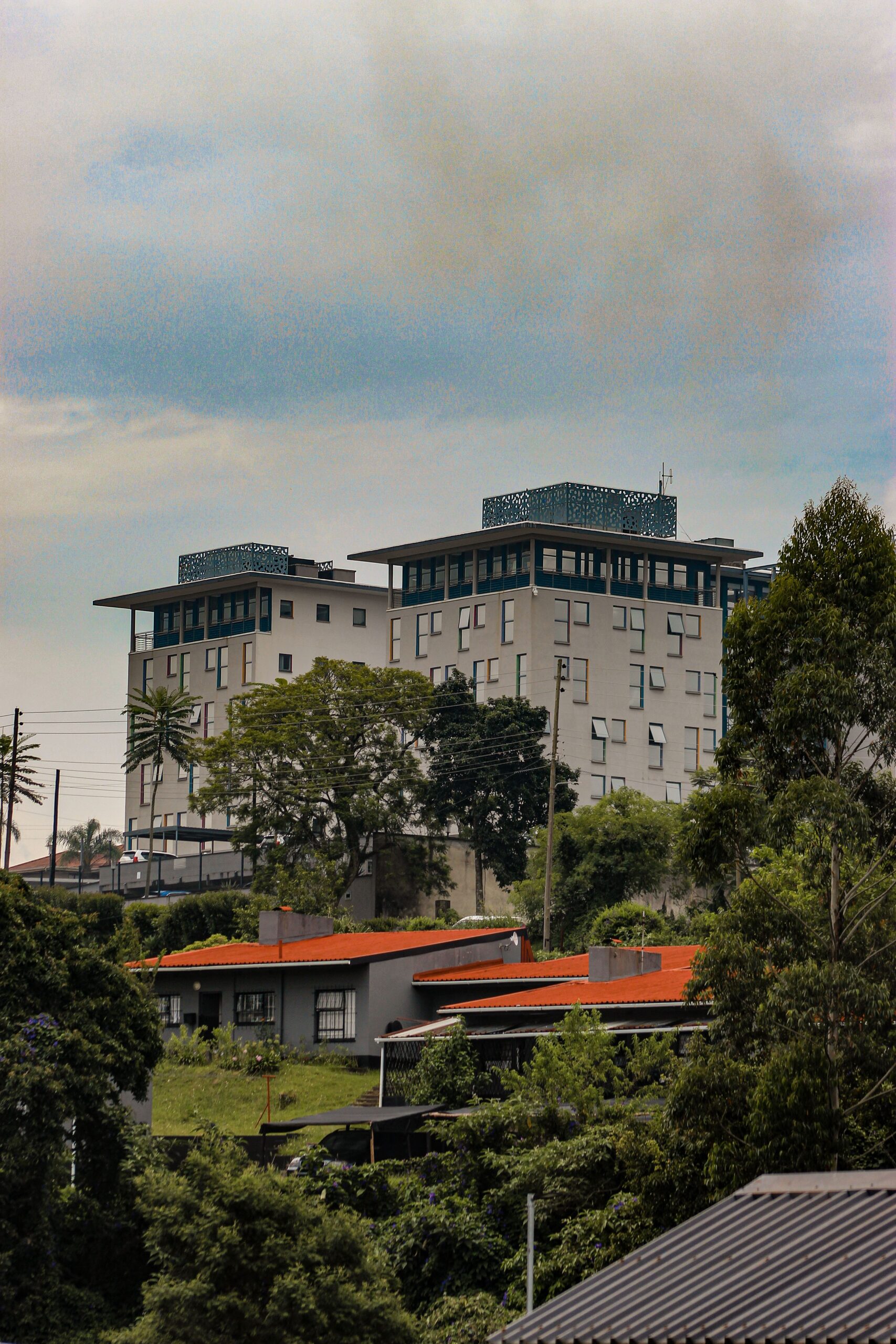 Explore the modern architecture amidst lush greenery in Mbabane, Eswatini.